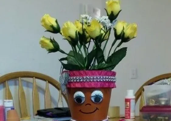 DIY Example: Orange Yarn Hairstyle for a Planter