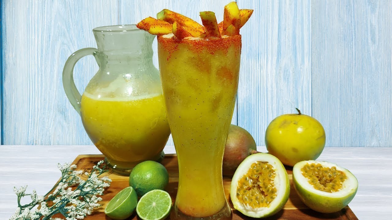 Refreshing passion fruit cocktail with tajin rim and fresh fruit garnish.
