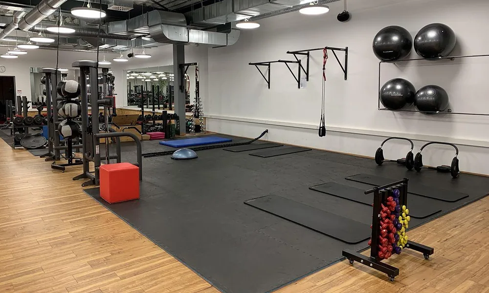 Peeacelily | Planet Fitness: Membership Costs, Equipment, Benefits, and What to Know Open functional fitness area equipped with exercise mats, stability balls, and light free weights