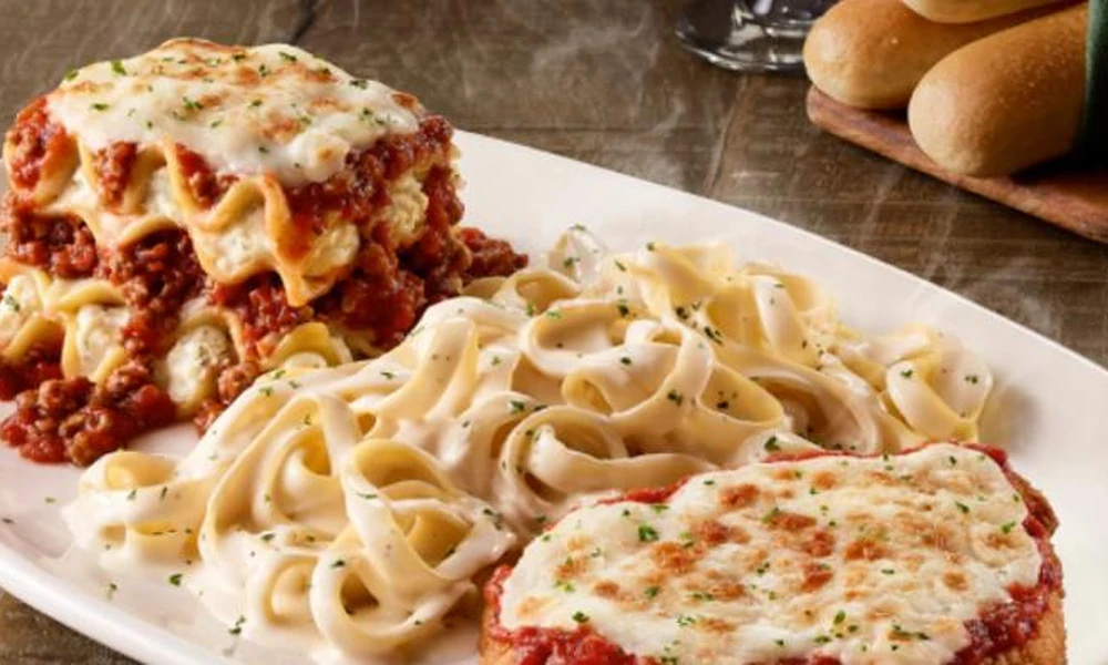 Peeacelily | Olive Garden: A Guide to the Menu, Dining, and Ordering Olive Garden Tour of Italy platter showcasing lasagna, fettuccine Alfredo, and chicken parmigiana