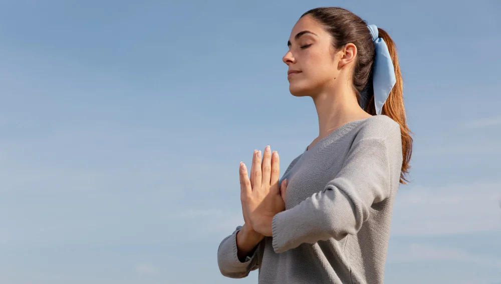 Side view woman meditating in nature